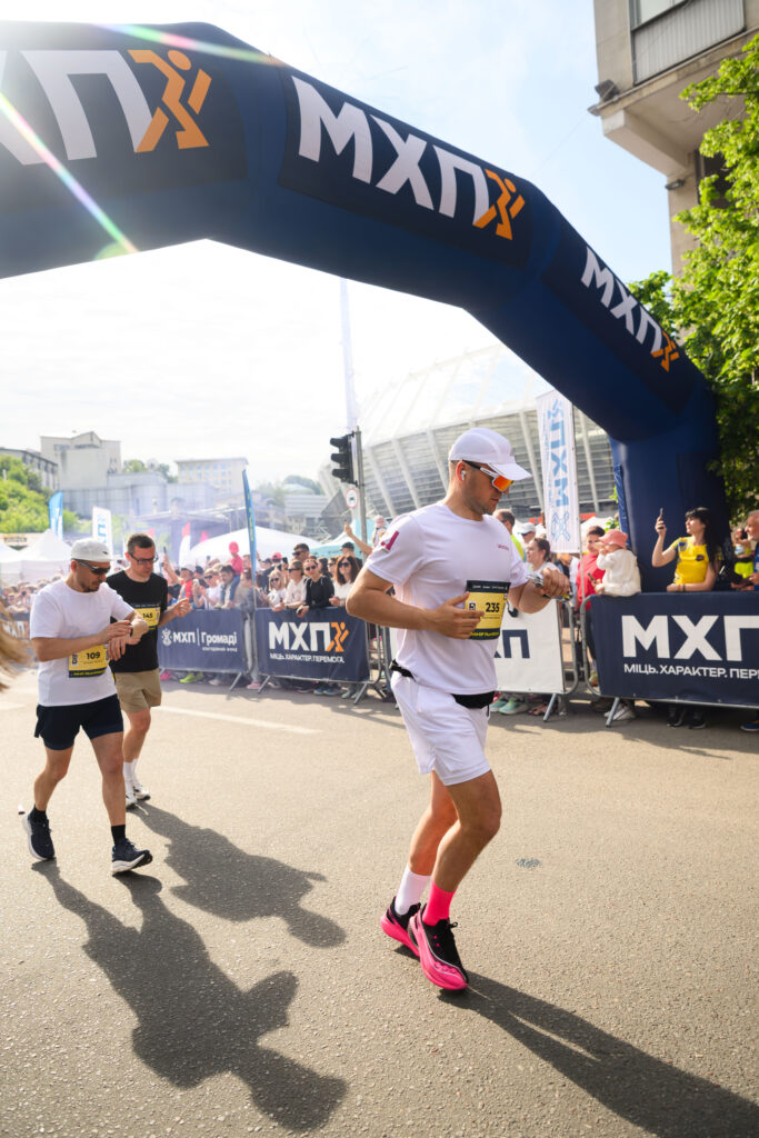 A runner crossing the Marathon finish line